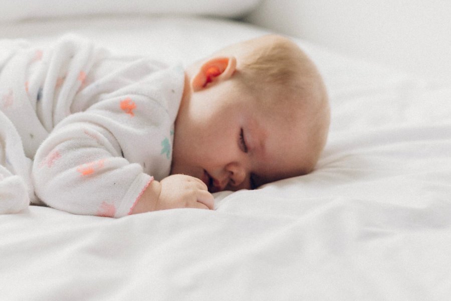 Baby sleeping in a crib.