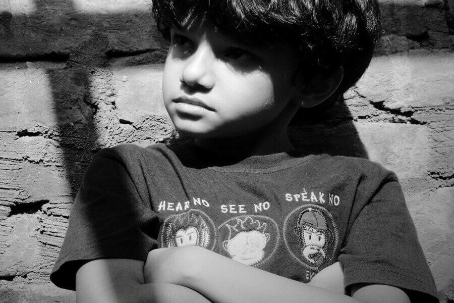 Kurn Hattin Legacy A sad young boy representing victims of abuse at Kurn Hattin